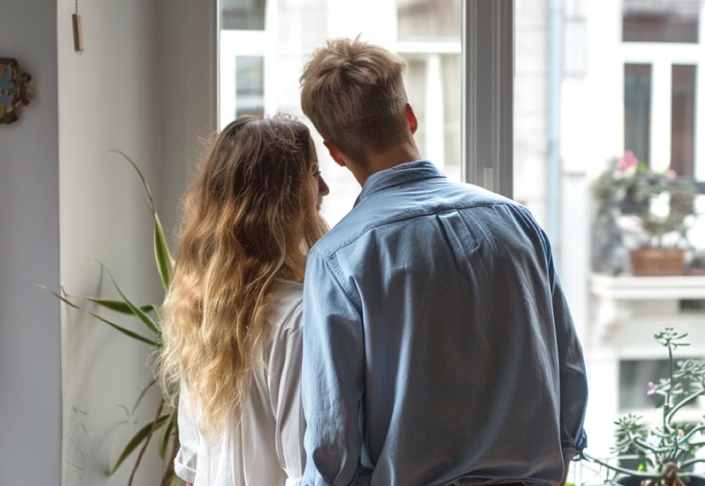 Couple staring at their new house